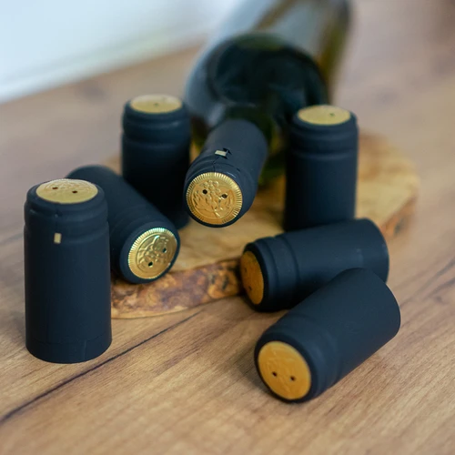 Perforatsiooniga termokahanevad kapslid, mustad, fi31 mm, 100 tk. - 2